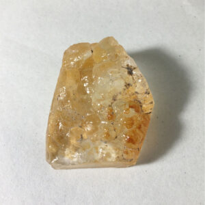 17.4 gram piece of Hyalite Opal rough rock on a white background. Front view.