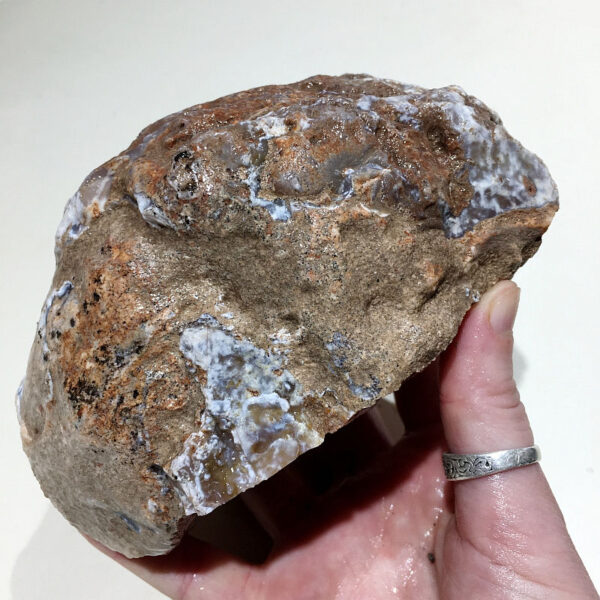 2.58 pound piece of Purple Burro Jasper rough rock, pictured wet. Side five of six sides.