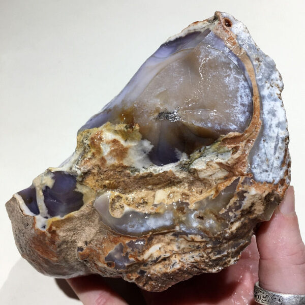 2.58 pound piece of Purple Burro Jasper rough rock, pictured wet. Side six of six sides.