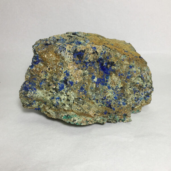 1.84 pound piece of Spotted Azurite rough rough, pictured dry on a white background